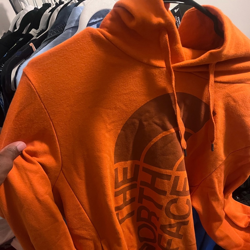 Barley worn Mens small orange north face hoodie.